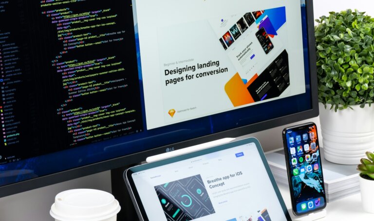 Design studio desk with monitor, tablet and phone